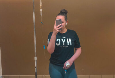 Image of Brooklyn hooked up to an IV in a t-shirt and leggings